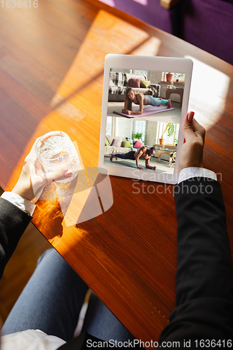 Image of Remote working. Workplace in bar, restaurant office with PC, devices and gadgets.