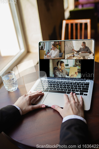 Image of Remote working. Workplace in bar, restaurant office with PC, devices and gadgets.