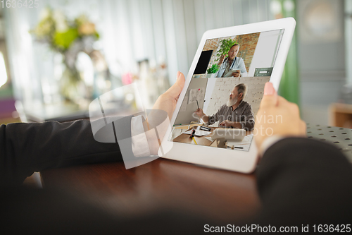 Image of Remote working. Workplace in bar, restaurant office with PC, devices and gadgets.