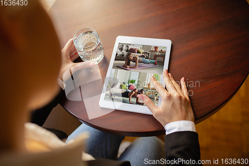 Image of Remote working. Workplace in bar, restaurant office with PC, devices and gadgets.