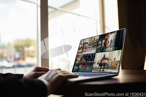 Image of Remote working. Workplace in bar, restaurant office with PC, devices and gadgets.