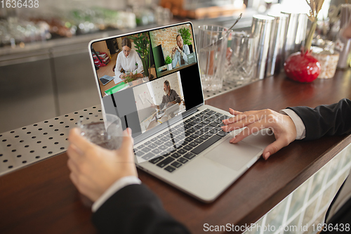 Image of Remote working. Workplace in bar, restaurant office with PC, devices and gadgets.