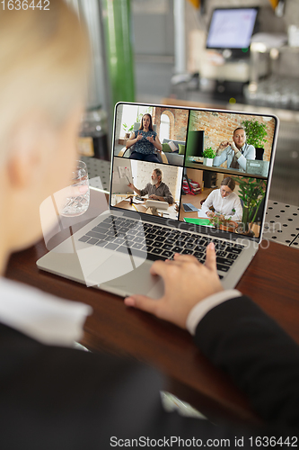 Image of Remote working. Workplace in bar, restaurant office with PC, devices and gadgets.