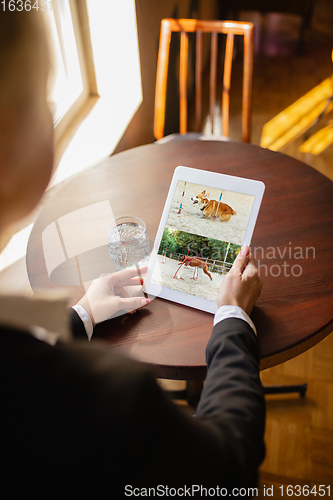 Image of Remote working. Workplace in bar, restaurant office with PC, devices and gadgets.