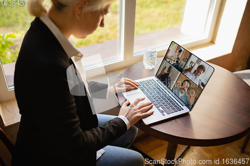 Image of Remote working. Workplace in bar, restaurant office with PC, devices and gadgets.