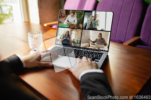 Image of Remote working. Workplace in bar, restaurant office with PC, devices and gadgets.