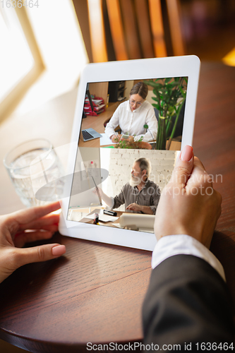 Image of Remote working. Workplace in bar, restaurant office with PC, devices and gadgets.