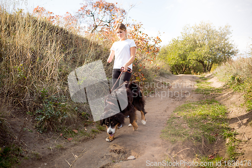 Image of Disabled woman walking down and training outdoors in forest