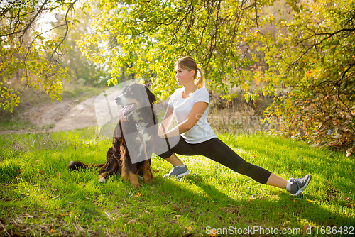 Image of Disabled woman walking down and training outdoors in forest