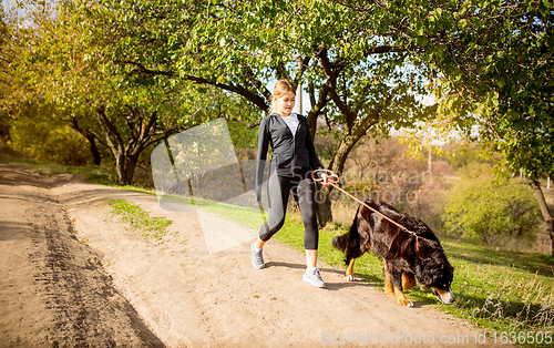 Image of Disabled woman walking down and training outdoors in forest