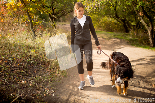 Image of Disabled woman walking down and training outdoors in forest