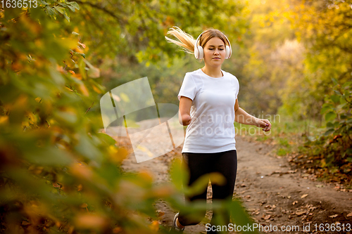 Image of Disabled woman walking down and training outdoors in forest