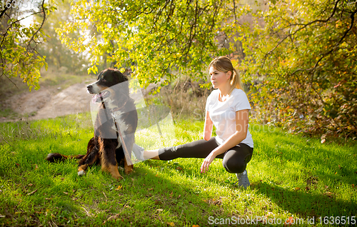 Image of Disabled woman walking down and training outdoors in forest