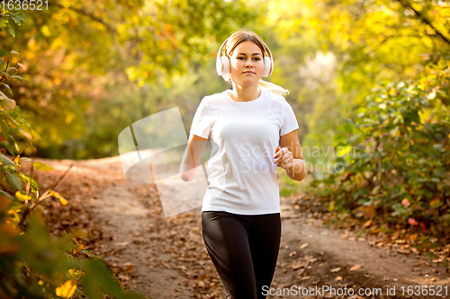 Image of Disabled woman walking down and training outdoors in forest