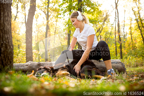 Image of Disabled woman walking down and training outdoors in forest