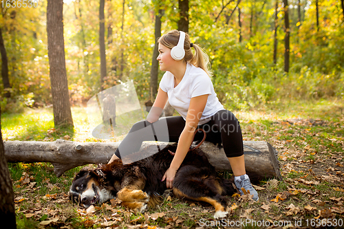 Image of Disabled woman walking down and training outdoors in forest