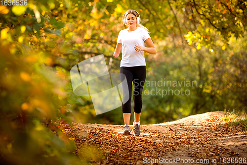 Image of Disabled woman walking down and training outdoors in forest