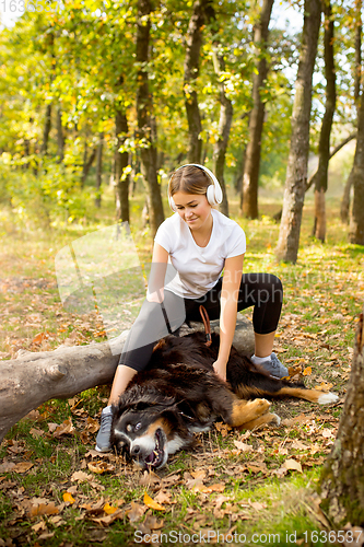 Image of Disabled woman walking down and training outdoors in forest