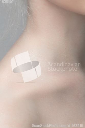 Image of Close up portrait of beautiful albino woman isolated on studio background. Beauty, fashion, skincare, cosmetics concept. Details.