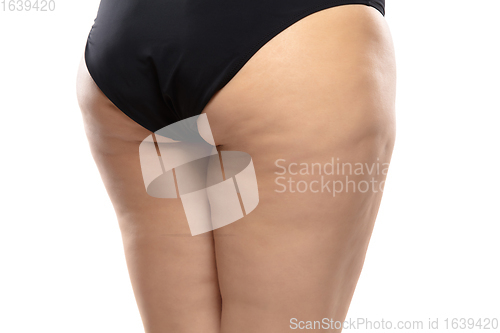 Image of Overweight woman with fat cellulite legs and buttocks, obesity female body in black underwear isolated on white background