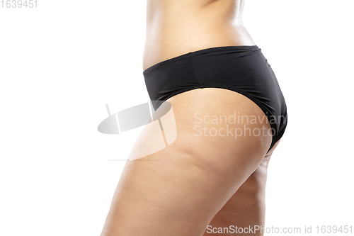 Image of Overweight woman with fat cellulite legs and buttocks, obesity female body in black underwear isolated on white background