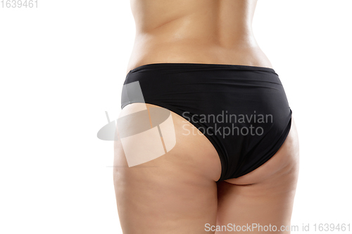 Image of Overweight woman with fat cellulite legs and buttocks, obesity female body in black underwear isolated on white background