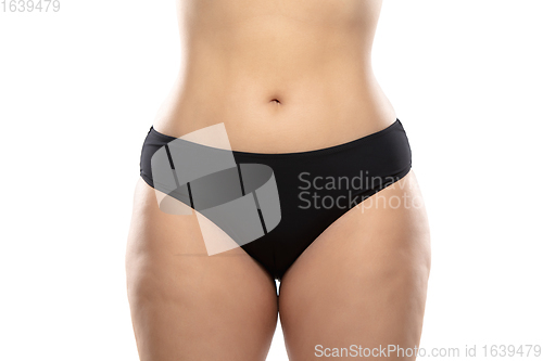 Image of Overweight woman with fat cellulite legs and buttocks, obesity female body in black underwear isolated on white background