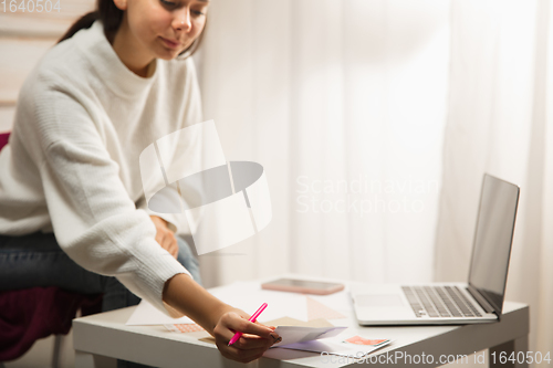 Image of Woman writing letter, greeting card for New Year and Christmas 2021 for friends or family