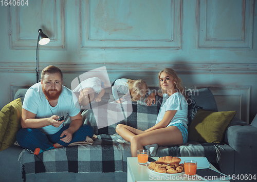 Image of Mother, father and kids at home having fun, comfort and cozy concept