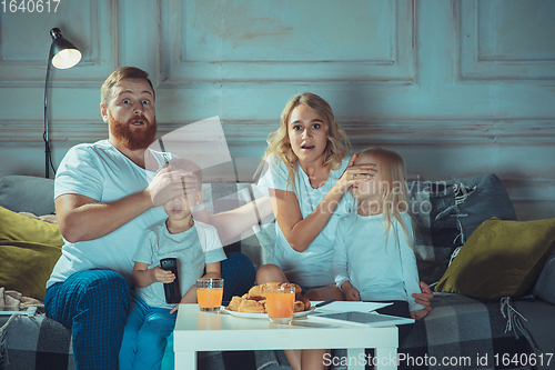 Image of Mother, father and kids at home having fun, comfort and cozy concept