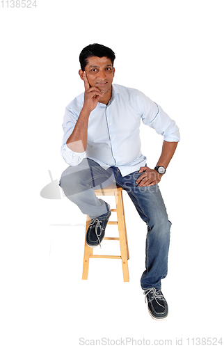 Image of Full length image of Asian man sitting