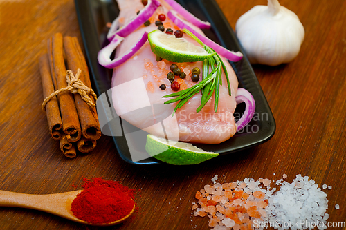 Image of fresh organic chicken breast with herbs and spices