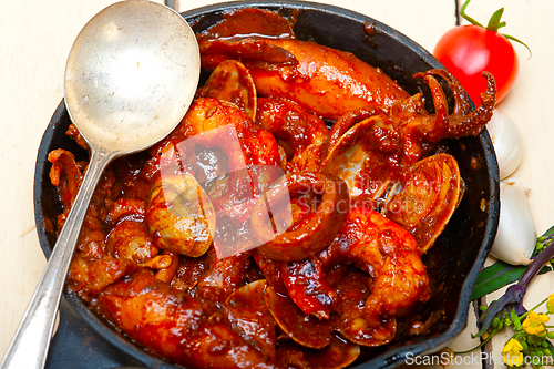 Image of fresh seafoos stew on an iron skillet