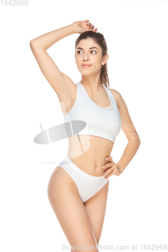 Image of Beautiful woman in underwear isolated on white background. Beauty, cosmetics, spa, depilation, diet, treatment and fitness concept, sensual posing