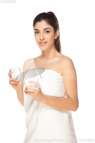 Image of Beautiful woman in towel isolated on white background. Beauty, cosmetics, spa, depilation, diet, treatment and fitness concept, sensual posing