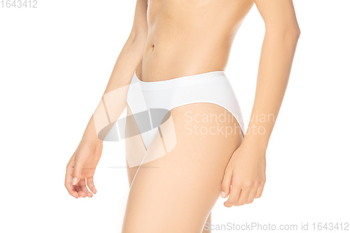 Image of Close up beautiful woman in underwear isolated on white background. Beauty, cosmetics, spa, depilation, diet, treatment and fitness concept, sensual posing