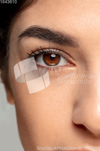 Image of Close up portrait of beautiful jewish woman isolated on studio background. Beauty, fashion, skincare, cosmetics concept. Details.