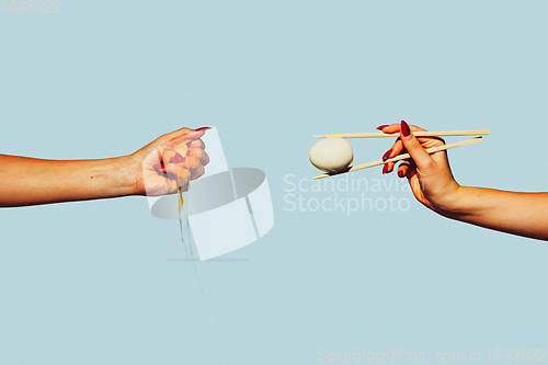 Image of Modern art collage in pop-art style. Hands isolated on trendy colored background with copyspace, contrast