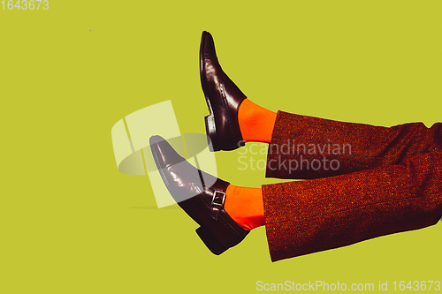 Image of Modern art collage in pop-art style. Legs in stylish shoes isolated on trendy colored background with copyspace, contrast