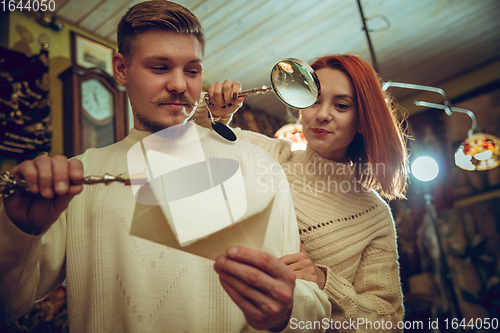 Image of Smiling family, couple looking for home decoration and holiday\'s gifts in household store