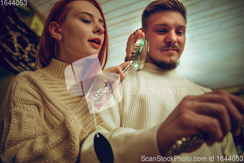 Image of Smiling family, couple looking for home decoration and holiday\'s gifts in household store