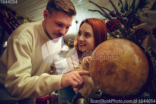 Image of Smiling family, couple looking for home decoration and holiday\'s gifts in household store