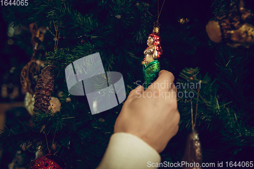 Image of Close up hands of woman looking for home decoration and holiday\'s gifts in household store