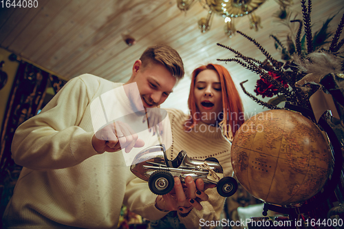 Image of Smiling family, couple looking for home decoration and holiday\'s gifts in household store