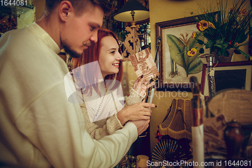 Image of Smiling family, couple looking for home decoration and holiday\'s gifts in household store