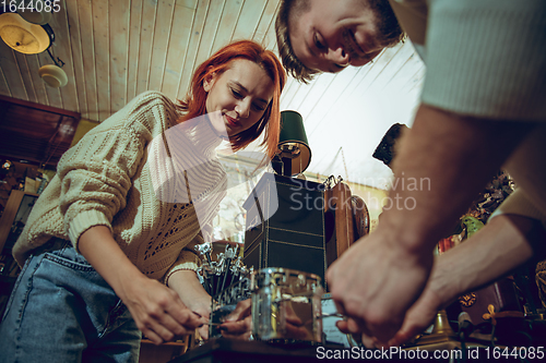 Image of Smiling family, couple looking for home decoration and holiday\'s gifts in household store