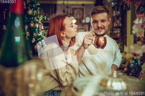 Image of Smiling family, couple looking for home decoration and holiday\'s gifts in household store