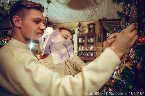 Image of Smiling family, couple looking for home decoration and holiday\'s gifts in household store