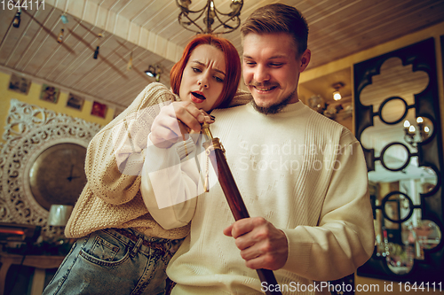 Image of Smiling family, couple looking for home decoration and holiday\'s gifts in household store