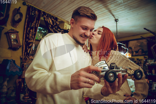 Image of Smiling family, couple looking for home decoration and holiday\'s gifts in household store